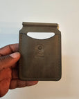 Handcrafted olive green leather money clip with natural finish by Tad Leathers