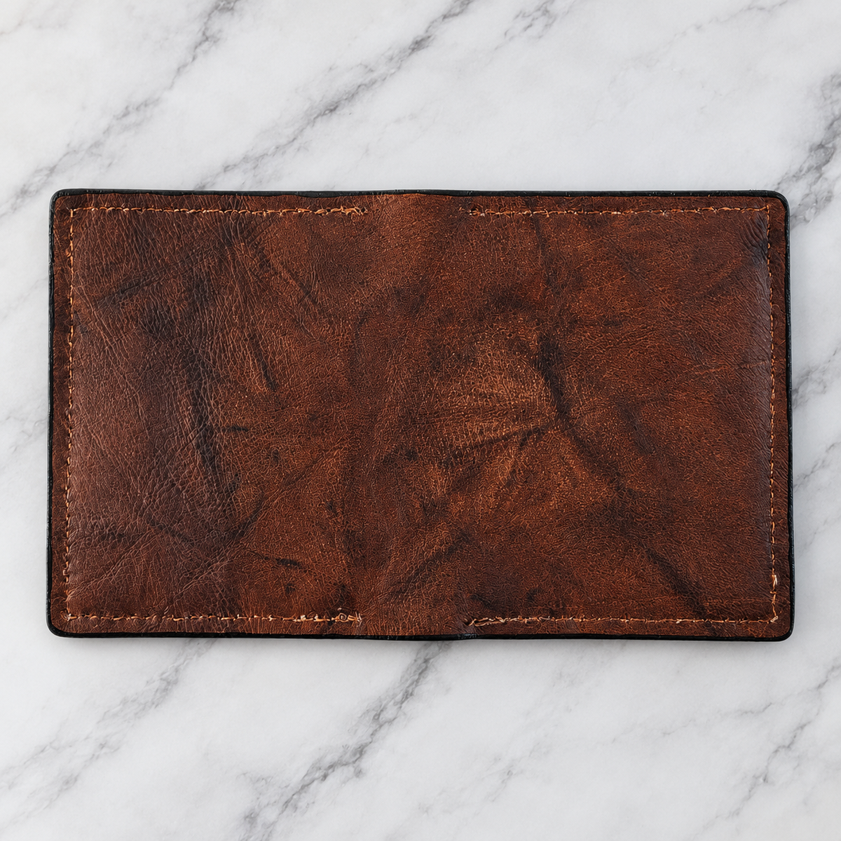 Rustic brown leather ID wallet exterior showing natural leather grain and brown stitching