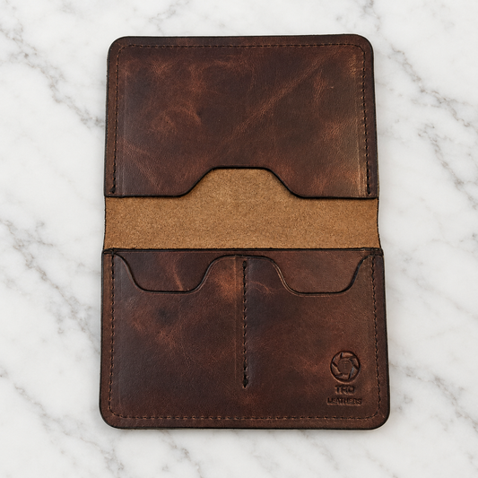 Volcano Brown Full-Grain Leather Passport Holder on light marble background