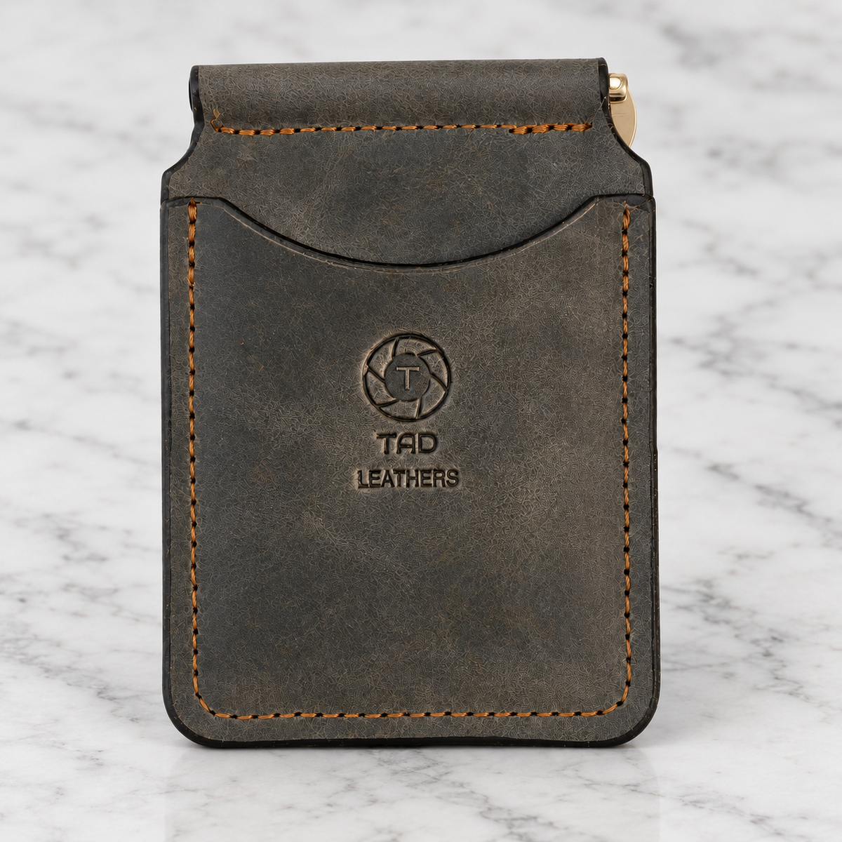 Moss Charcoal Leather Money Clip Wallet on light marble background