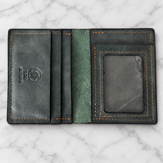 Green Charcoal Full-Grain Leather ID Wallet on light marble background