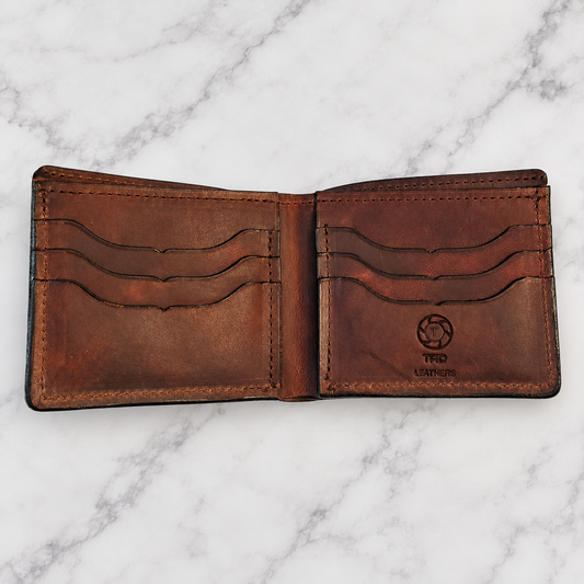 Brown Full-Grain Leather Bifold Wallet on light white and gray marble background