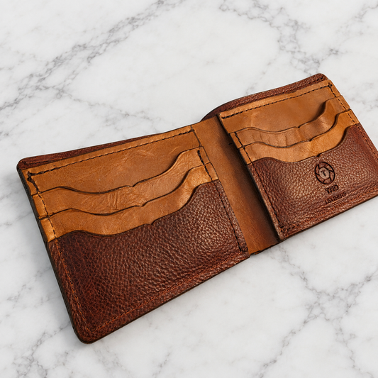 Multi-Brown Full-Grain Leather Bifold Wallet on light marble background