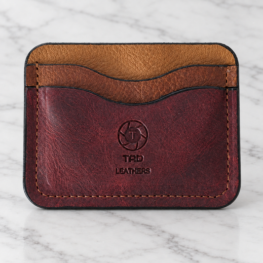 Burgundy & Saddle Brown Leather Cardholder — One of One on light marble background