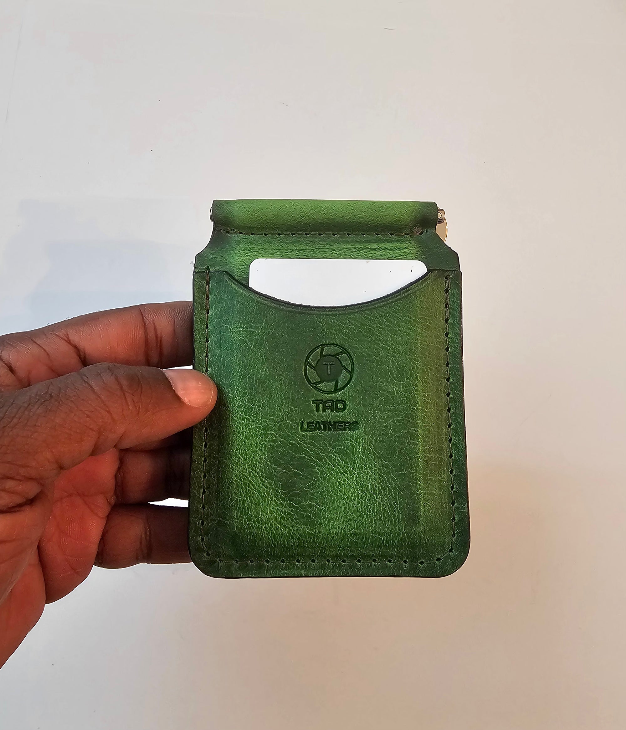 Handcrafted electric green leather money clip with vibrant finish by Tad Leathers