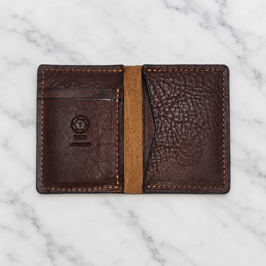 Brown Pebble Grain Minimalist Wallet on light marble background