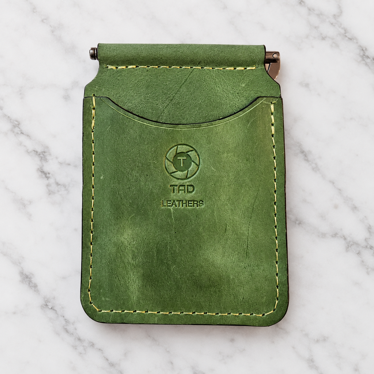 Vibrant Green Leather Money Clip Wallet on light marble background