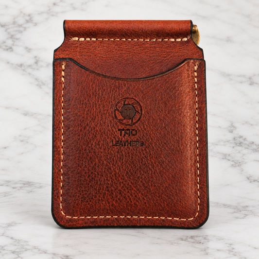 Cognac Brown Embossed Leather Money Clip Wallet on light marble background
