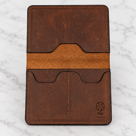Brown Leather Passport Holder on light marble background