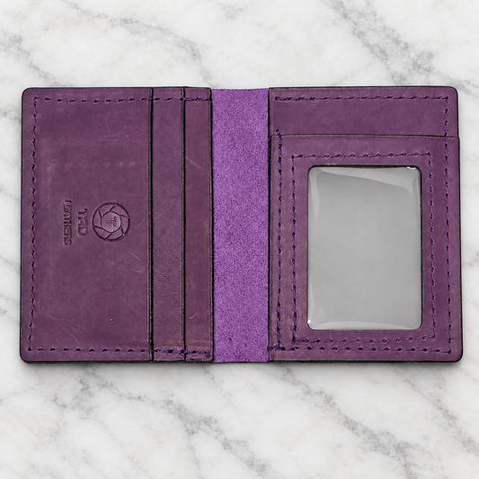 Royal Plum Leather ID Wallet on light white and gray marble background