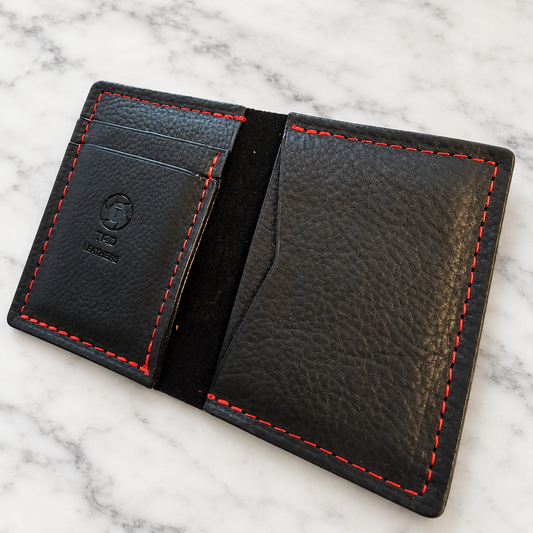Midnight Ember Full-Grain Leather Minimalist Wallet on light marble background