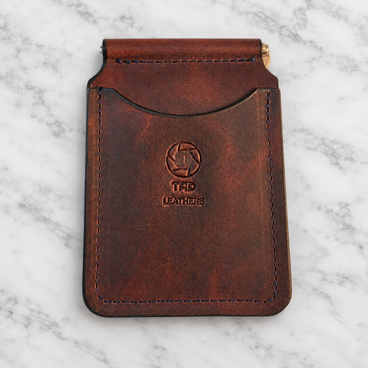 Chocolate Brown Leather Money Clip Wallet on light white and gray marble background
