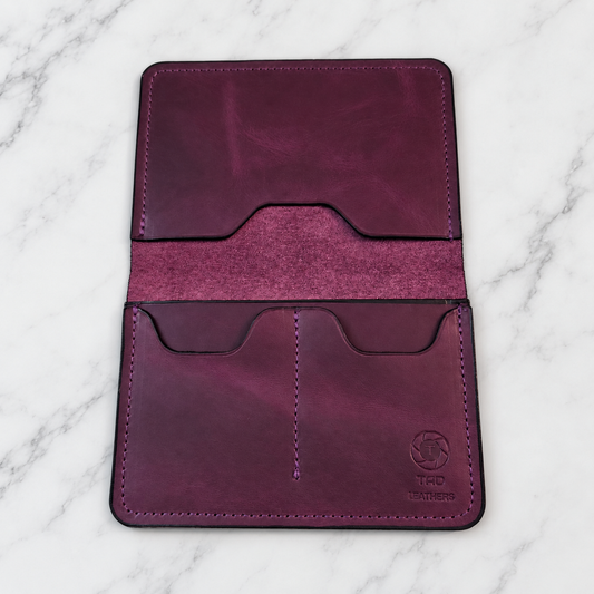Royal Purple Leather Passport Holder on light marble background