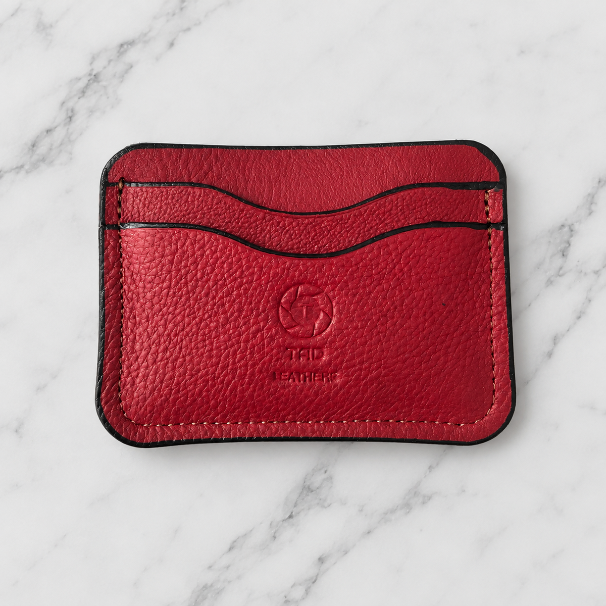Red Full-Grain Leather Slim Wallet on light marble background