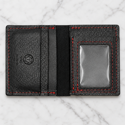 Black Leather ID Wallet with Red Stitching on light marble background