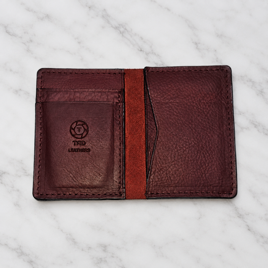 Burgundy Full-Grain Leather Minimalist Wallet on light marble background