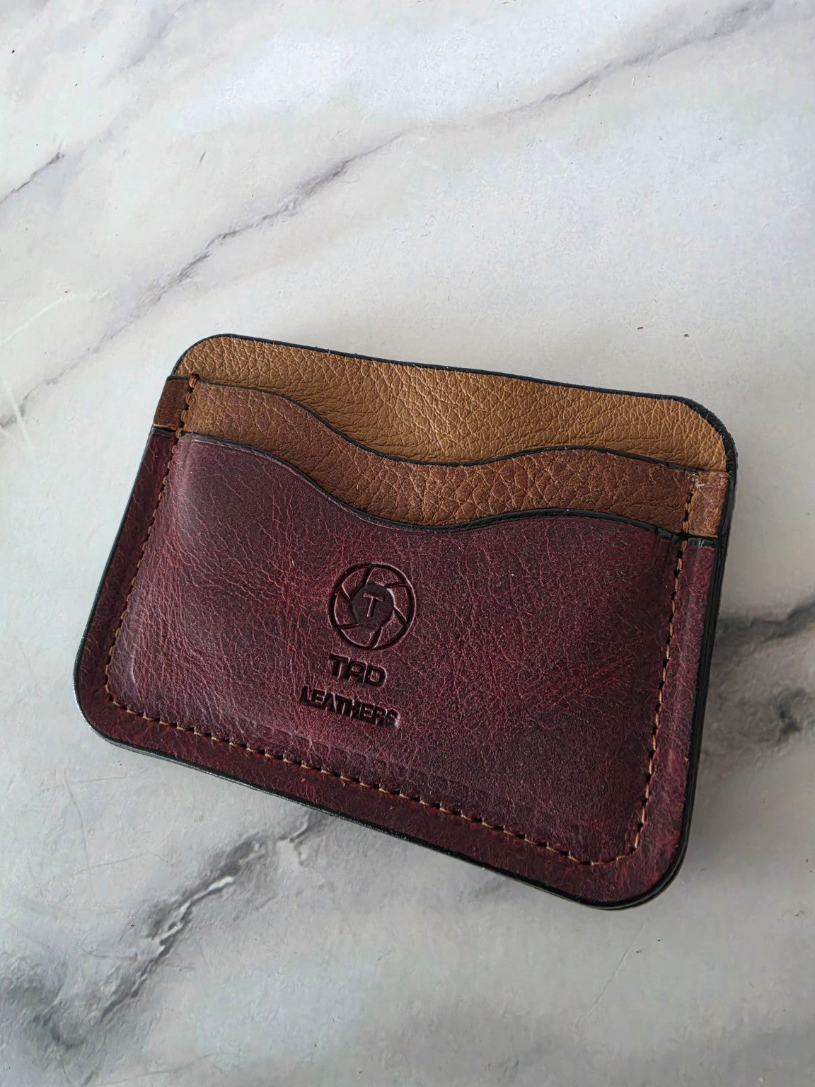 Burgundy and saddle brown one-of-one leather cardholder angled front