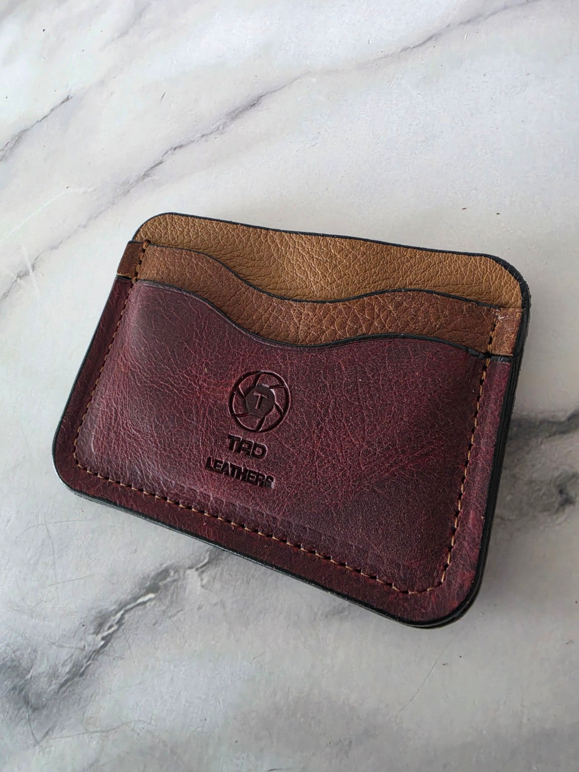 Burgundy and saddle brown one-of-one leather cardholder close angle