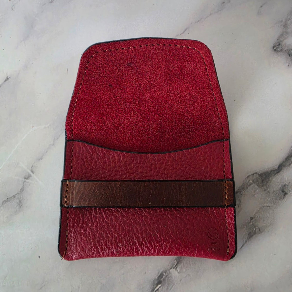 Crimson Ridge leather keeper pouch open to show the red interior