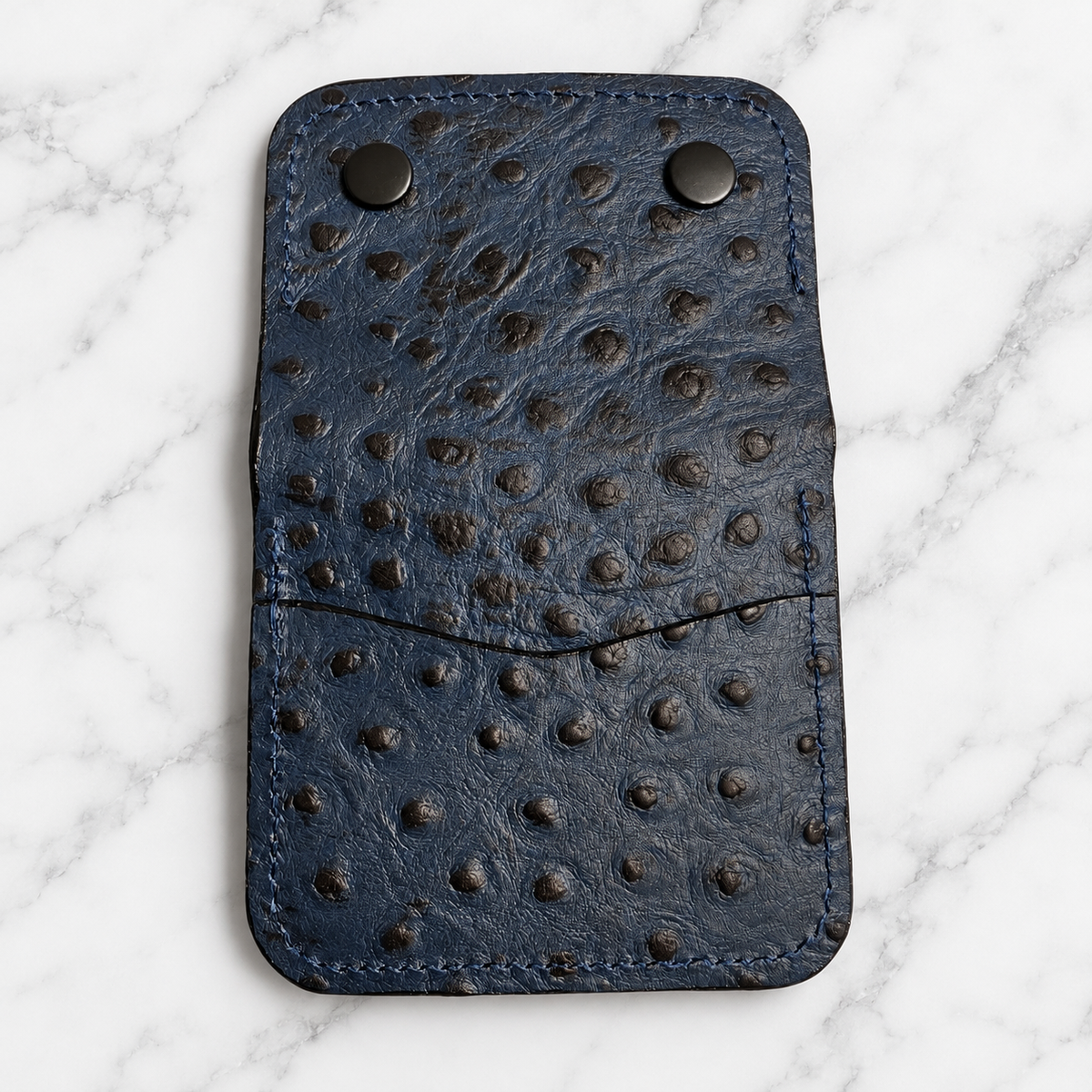 Unfolded midnight blue snap wallet exterior