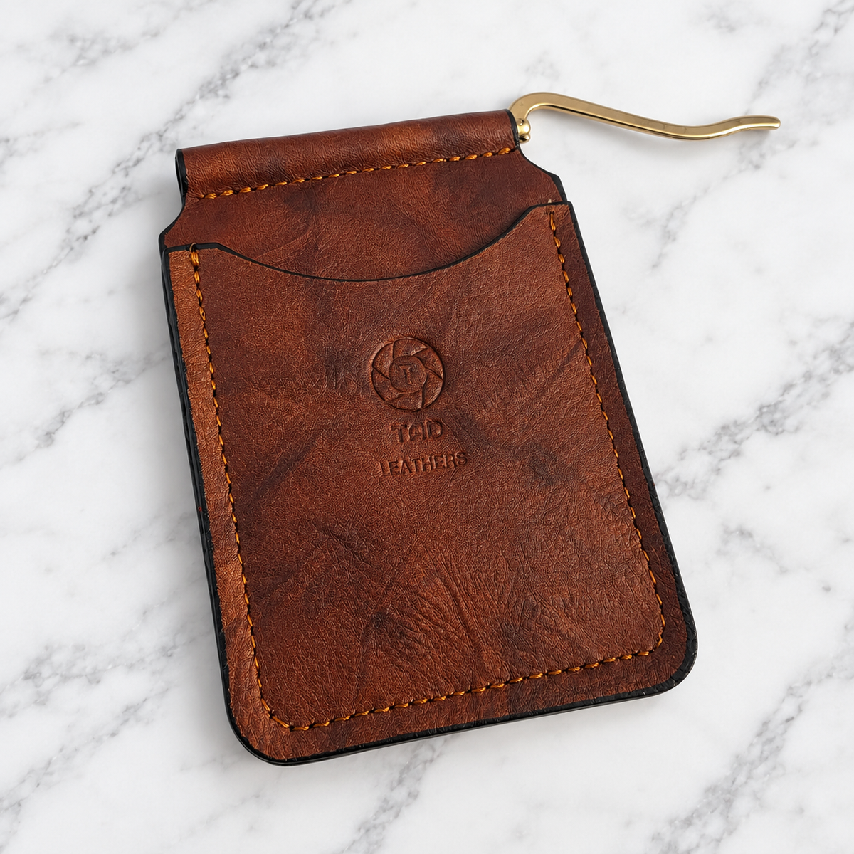 Rustic brown leather wallet showing extended spring money clip