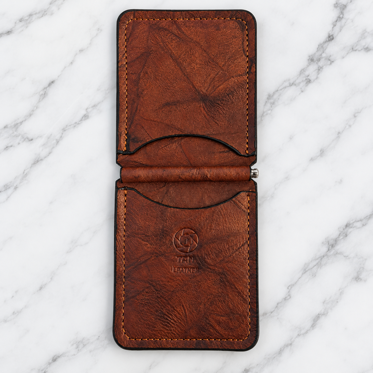 Rustic brown leather money clip wallet opened to show card pockets
