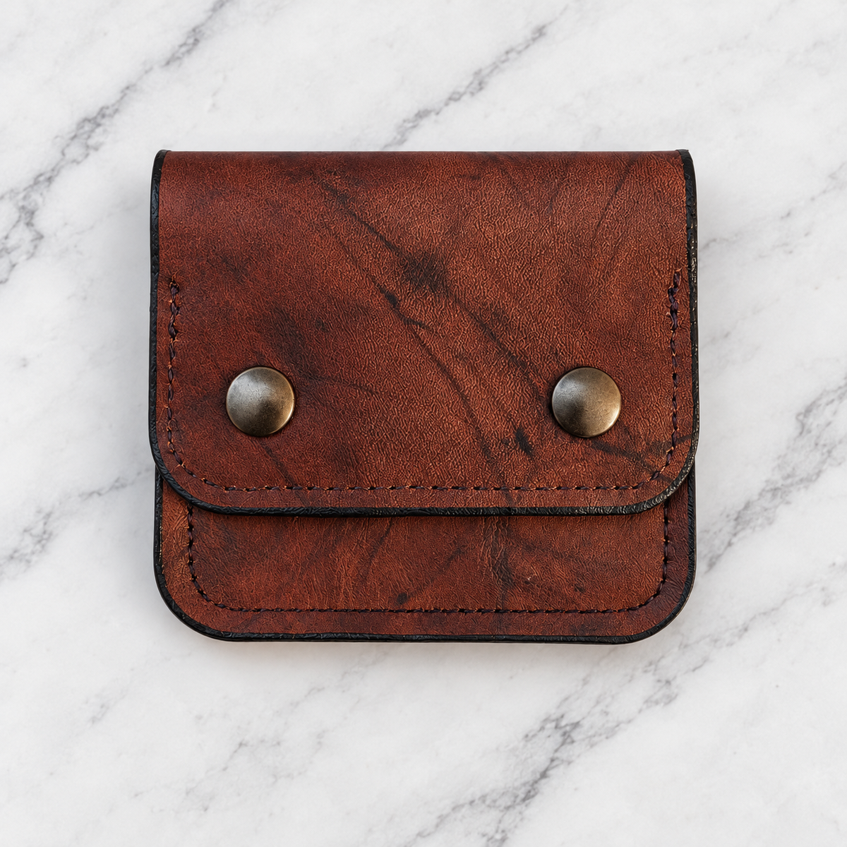 Rustic brown leather double-snap wallet, front view