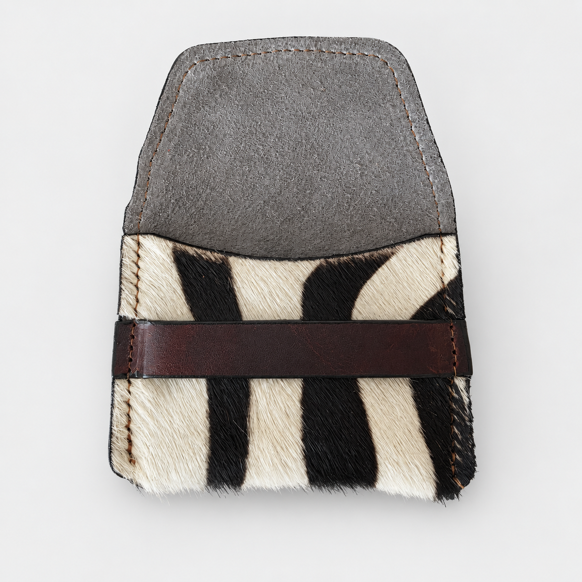 Savanna Stripe hair-on-hide leather pouch shown open with suede interior