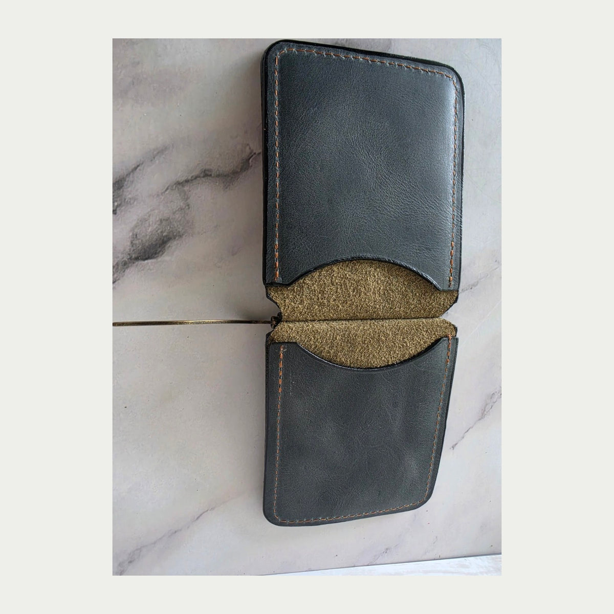 Open back view of charcoal and olive leather spring-bar money clip wallet