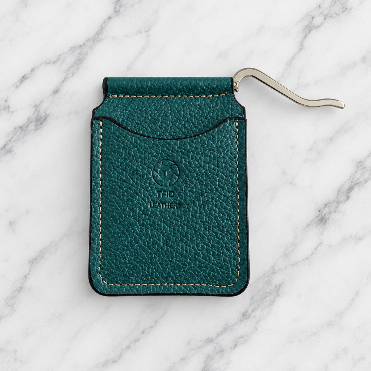 Closed teal leather wallet with silver spring money clip extended