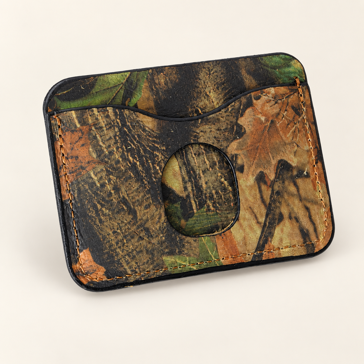 Handmade woodland camouflage leather card wallet, angled back view