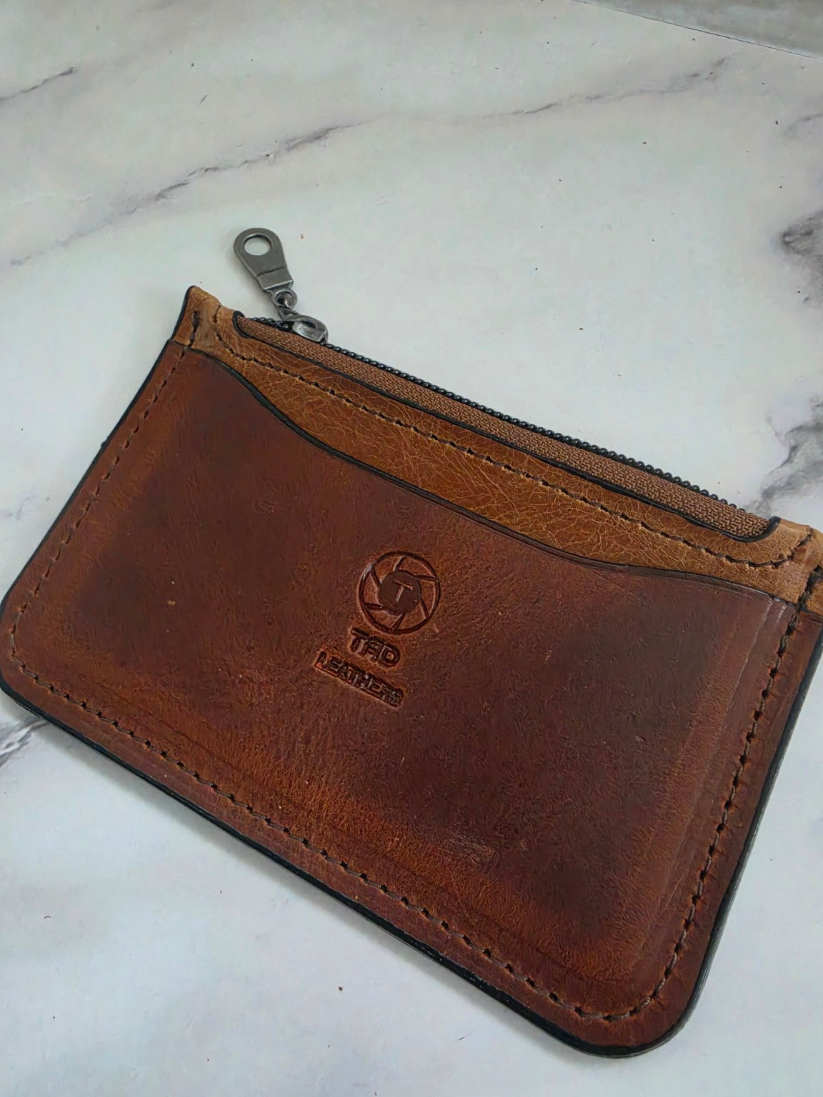 Cognac Brown leather zipper pouch stitching detail