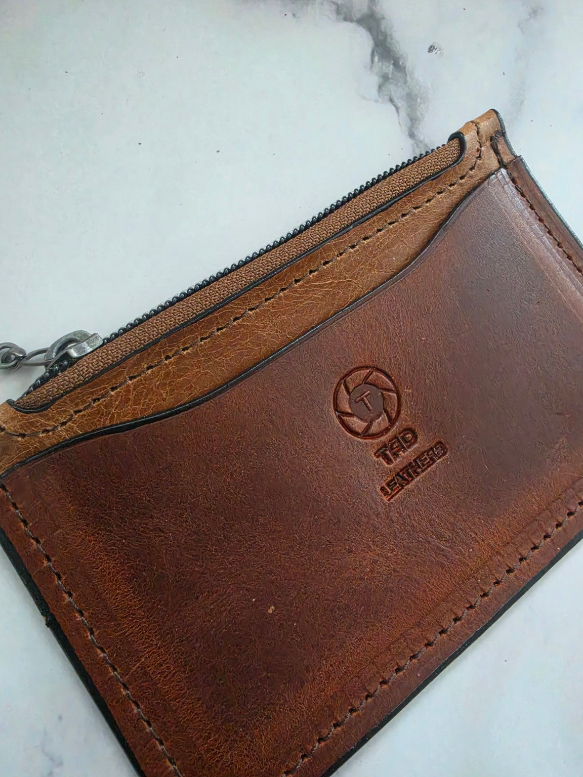 Cognac Brown leather zipper pouch Tad Leathers maker mark